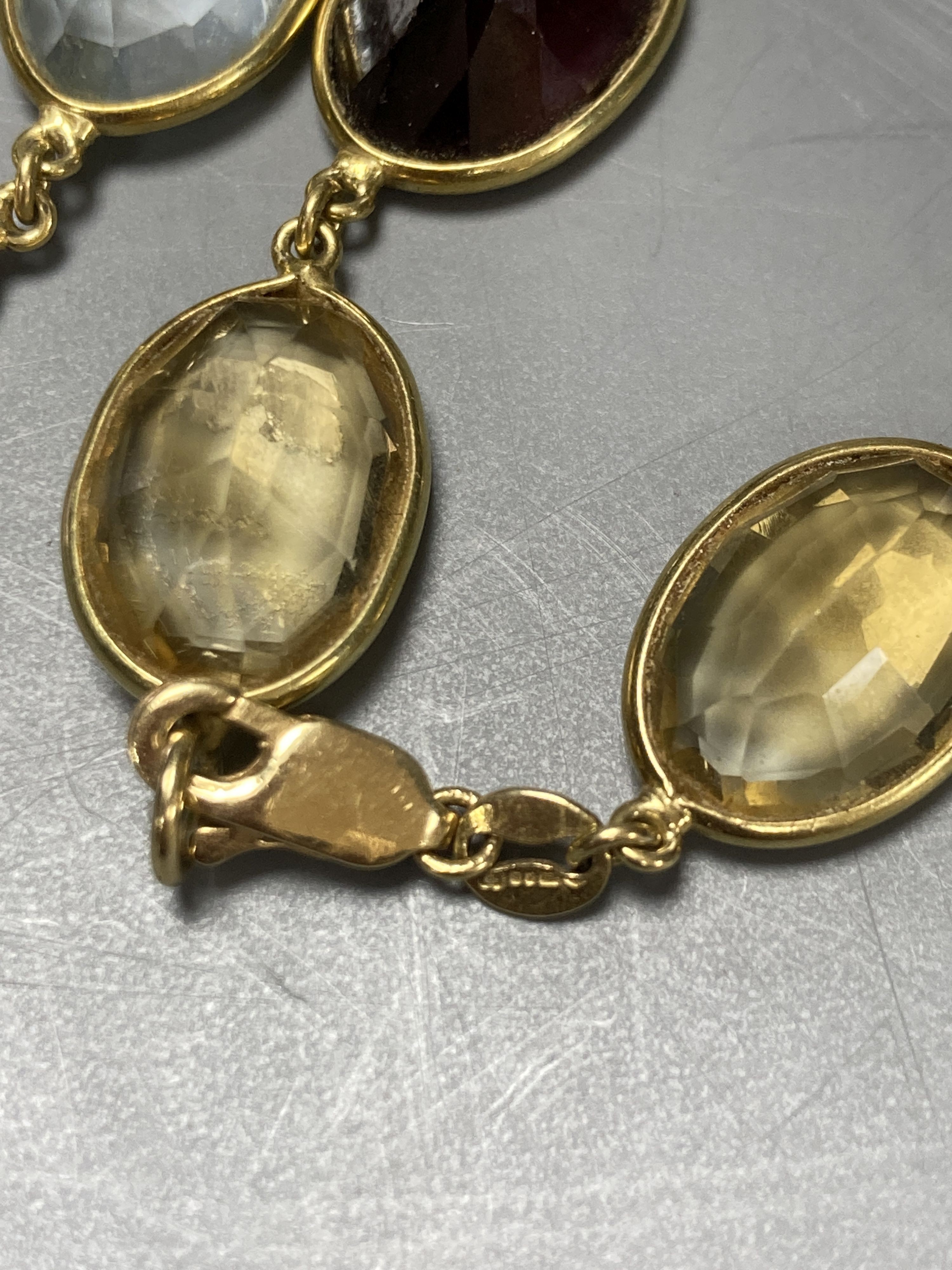An 18ct gold multi gem spectacle set necklace, 48cm.